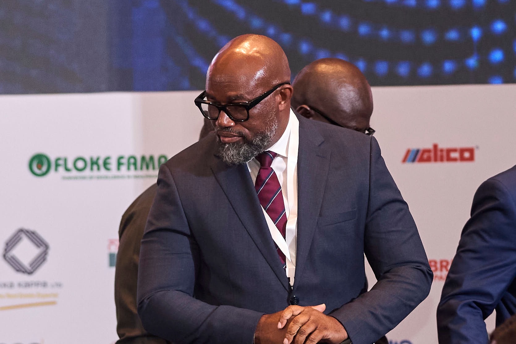 A delegate greeting guests on the summit floor