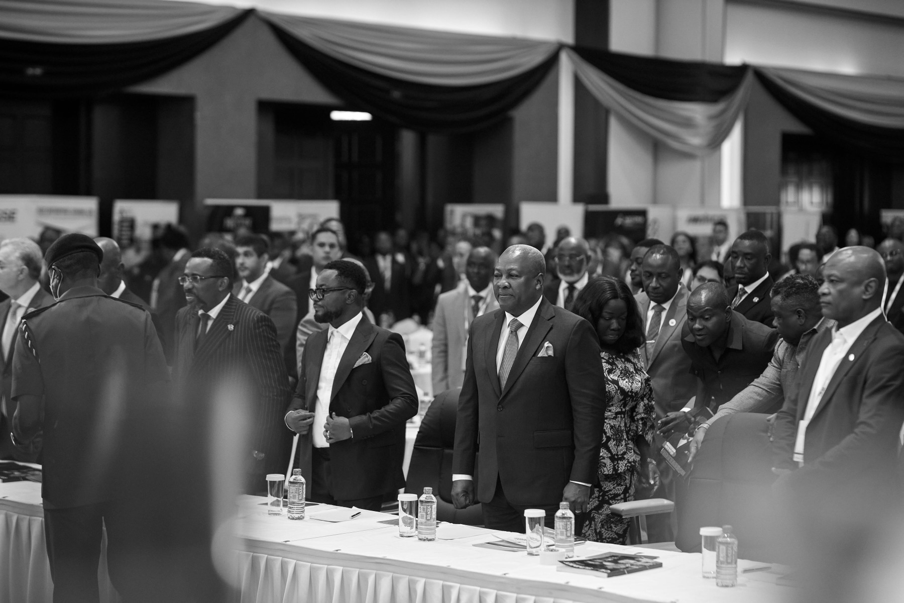 Delegates standing in the main hall