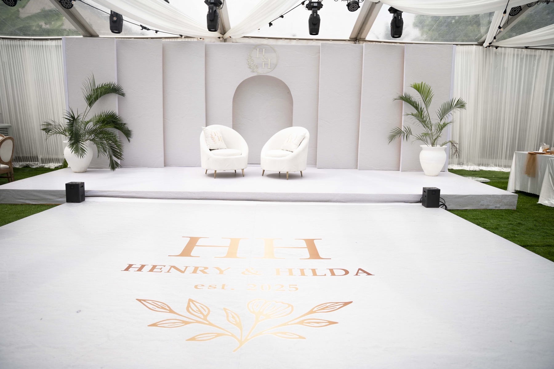 The dance floor and monogrammed backdrop
