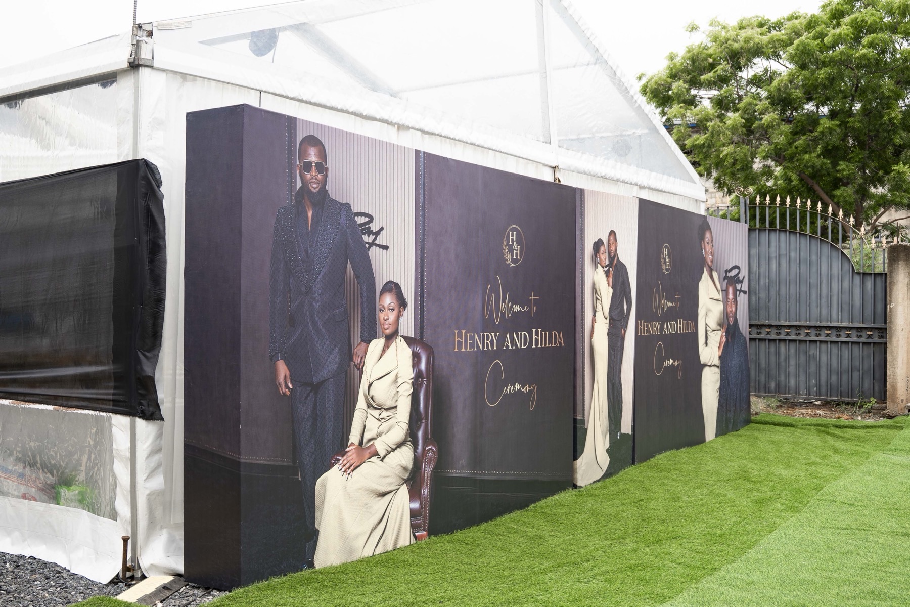 The printed welcome wall at the marquee entrance